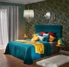 A bedroom scene with a bed, wallpaper, and decor. Náhled obrázku produktu