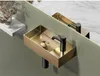 A modern bathroom sink with a gold basin and black faucet, reflected in a mirror. Produktbild-Vorschau