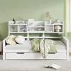 A white daybed with a bookshelf headboard is shown in a room with a light green wall. Náhled obrázku produktu
