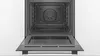 An open built-in oven with the door lowered. Produktbild-Vorschau