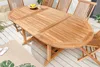 An oval wooden garden table with chairs on a wooden deck. Produktbild-Vorschau