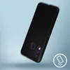A black smartphone case is shown at an angle against a light blue and gray background. A circular icon with a phone and radiating lines is in the bottom right corner. Podgląd zdjęcia produktu