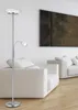 A modern living room with a floor lamp and sofas. Produktbild-Vorschau