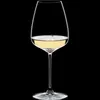 A single wine glass filled with white wine, isolated on a black background. Produktbild-Vorschau