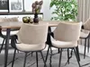 A dining room setting with a wooden table and chairs, decorated with a vase of flowers and decorative objects. Podgląd zdjęcia produktu