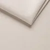 A close-up view of a folded piece of ecru fabric, likely upholstery or bedding material. Produktbild-Vorschau