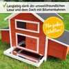 A red wooden chicken coop with a white trim and a black roof, set on a grassy lawn. Produktbild-Vorschau