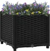 A black woven planter filled with colorful flowers. Náhľad obrázku produktu