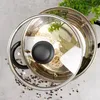A top-down view of a pot with a glass lid, containing noodles and bay leaves, with peppercorns scattered around. Náhled obrázku produktu