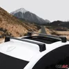 A white car with black roof racks is parked on a dirt road with mountains in the background. Voir les images du produit