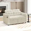 A beige sofa with storage drawers is shown in a living room setting, with a fireplace and a side table visible. Podgląd zdjęcia produktu
