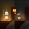 A split image showing two ways to use a candle warmer lamp. The left side shows the electric lamp with a candle, and the right side shows a person lighting a candle with a match. Náhled obrázku produktu