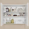 An open white medicine cabinet filled with various bathroom and skincare products. Voir les images du produit