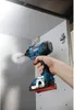 A hand is using a Bosch drill to screw into a cabinet. Anteprima dell’immagine prodotto