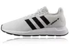 A white Adidas sneaker with black stripes is shown against a white background. Produktbild-Vorschau