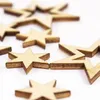 Scattered wooden stars on a white background. Produktbild-Vorschau