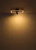 A modern ceiling light fixture with a rectangular frame and a spotlight, mounted on a white ceiling, casting a warm glow on the wall below. Podgląd zdjęcia produktu