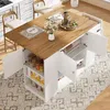A kitchen island with a drop-leaf table, chairs, and storage cabinets, set up in a kitchen or dining area. Náhled obrázku produktu