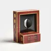 A product display box for a moon clock, showing the clock mechanism inside. Produktbild-Vorschau
