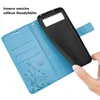 A hand holding a blue phone case with a black inner silicone holder. Produktbild-Vorschau