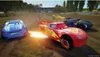 Cars racing on a dirt track with a stadium in the background. Náhled obrázku produktu