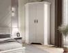 A white corner wardrobe in a bedroom setting. Produktbild-Vorschau