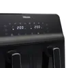 Close-up of the digital control panel of a black dual air fryer. Voir les images du produit