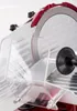 A close-up view of a red meat slicer. Náhled obrázku produktu