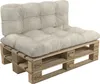 A beige cushion set on a wooden pallet. Voir les images du produit