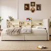 A bedroom scene featuring a beige upholstered bed with a built-in bookshelf headboard. Produktbild-Vorschau