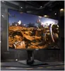 A computer monitor displaying a landscape scene, set in a dark, industrial-looking environment. Produktbild-Vorschau