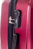 A close-up of a red suitcase showing the combination lock and zipper. Podgląd zdjęcia produktu