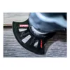 A close-up shot of a saw blade attached to a power tool, resting on a wooden surface. Voir les images du produit