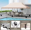 A beige pop-up canopy tent set up over a dining table and chairs next to a swimming pool. Náhled obrázku produktu