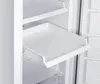 Close-up view of the interior of a white refrigerator or freezer, showing a pull-out shelf. Produktbild-Vorschau