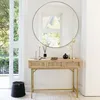 A console table with a mirror above it, decorated with a lamp, vase, and other items, in a hallway or entryway. Anteprima dell’immagine prodotto