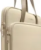 A close-up view of a beige laptop bag with tan handles and zippers. Náhľad obrázku produktu