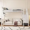A white metal loft bed with a sofa underneath, set in a room with cream-colored walls and a patterned rug. Anteprima dell’immagine prodotto