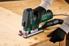 A person is using a jigsaw to cut a piece of wood. Produktbild-Vorschau