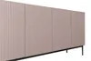 A close-up, side view of a pink ribbed cabinet on black legs. Podgląd zdjęcia produktu