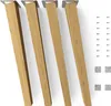 Four wooden furniture legs with metal mounting plates, along with screws and felt pads, are arranged on a white background. Produktbild-Vorschau