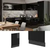 A modern black high-gloss kitchen with a wooden dining table and chairs in the foreground. Náhled obrázku produktu