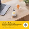 A breast pump and laptop are on a table, with text describing the product's features. Voir les images du produit