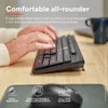 A person's hands typing on a black keyboard, with a mouse and mousepad in the foreground. Náhled obrázku produktu