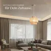 A living room with a sectional sofa, coffee table, chair, and curtains, featuring a pendant light. Produktbild-Vorschau