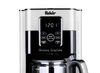 Close-up of a coffee maker's control panel and carafe. Náhled obrázku produktu
