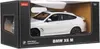 A white BMW X6 M toy car is displayed in its retail packaging. Podgląd zdjęcia produktu