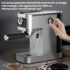 A hand is shown adjusting a dial on a silver espresso machine, with a cup of coffee and coffee beans in the foreground. Náhľad obrázku produktu