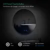 A round LED mirror in a bathroom setting, with touch controls visible on the mirror surface. Produktbild-Vorschau