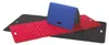 Three foldable mats are arranged on a white background. One blue mat is standing upright, folded in half. Two other mats, one red and one black, are lying flat underneath the blue one. Produktbild-Vorschau